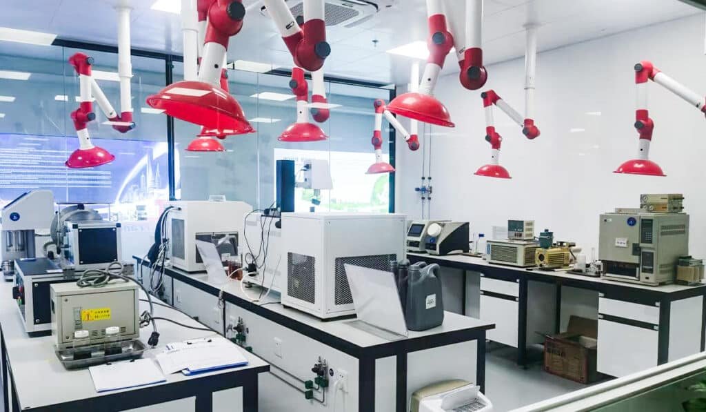 Modern laboratory with testing equipment for engine oil analysis where experts answer common FAQ on viscosity additives synthetic oil performance and oil change intervals building trust in YEFE formulations