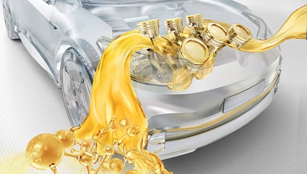 Golden lubricant oil flowing into a transparent hybrid car engine, illustrating how green lubricants with renewable base oils and low‑SAPS additives reduce the carbon footprint across the lifecycle from production to disposal