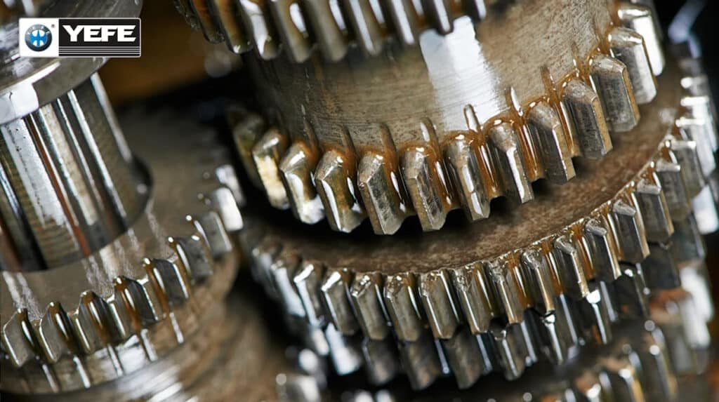 Close-up of damaged heavy-duty gear teeth showing pitting, scuffing and wear patterns caused by gear oil degradation, oxidation, insufficient EP protection and contamination, highlighting need for proper YEFE gear oil maintenance.