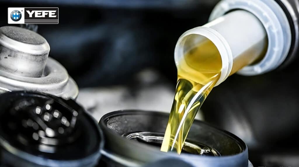 Golden YEFE engine oil pouring from bottle into automotive oil filter housing showcasing highly refined Group III base oil with >90% saturates low sulfur >120 VI providing excellent oxidation stability volatility control and temperature performance for premium synthetic blend engine oils