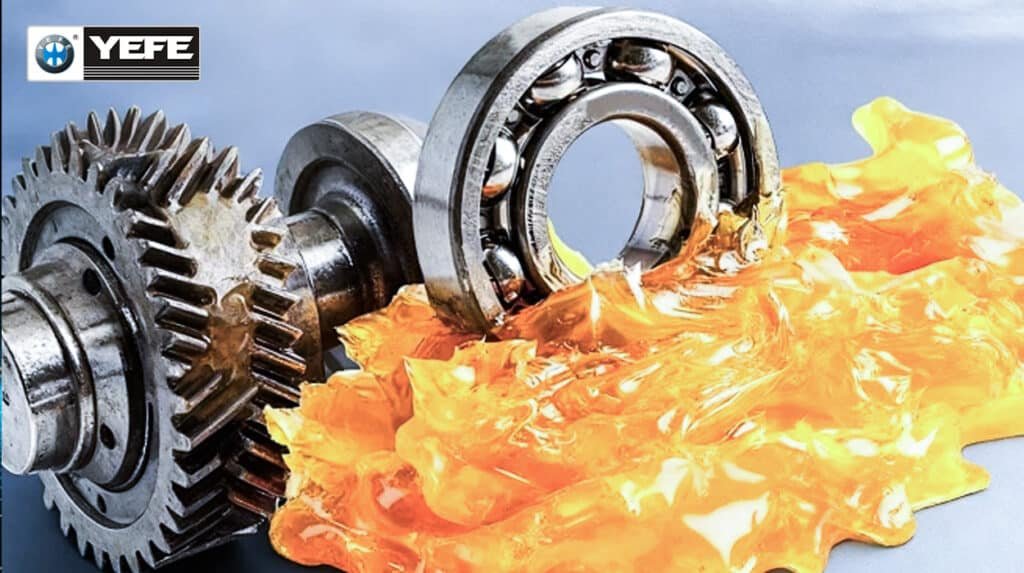 Golden YEFE grease coating heavy-duty gears and bearings, demonstrating high EP load-carrying capacity, wear protection and mechanical stability essential for construction, mining and industrial equipment under shock loads and contamination.
