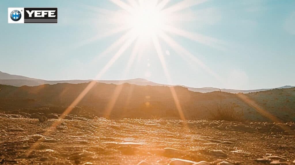 Blazing sun over desert landscape representing intense heat stress in hot climate countries where YEFE engine oil provides superior oxidation resistance high VI and viscosity stability for reliable engine protection under prolonged high temperature operation