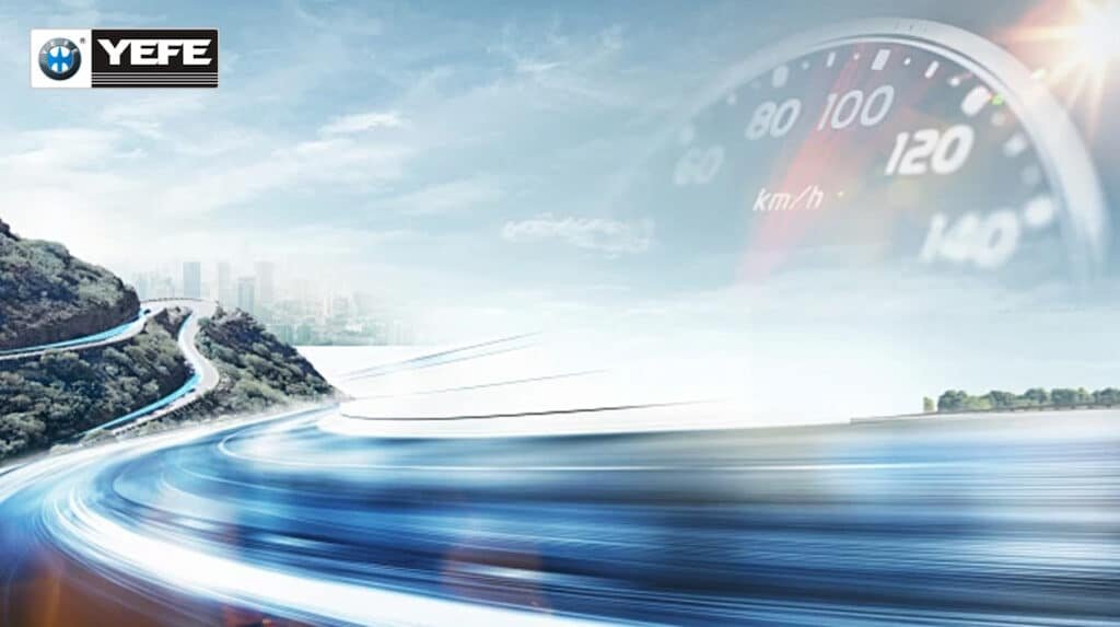 Dynamic speedometer at 140 km/h with BMW speeding on mountain highway road overlooking city lake under sunny sky YEFE branding highlighting superior engine oil shear stability high temperature protection and sustained performance for high-mileage engines at highway speeds
