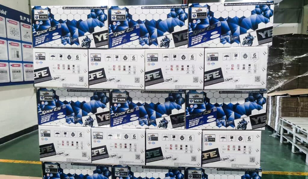 Stacked cartons of YEFE branded engine oil in warehouse showing efficient production and packaging for private label OEM projects meeting distributor MOQ requirements with fast lead times and quality consistency