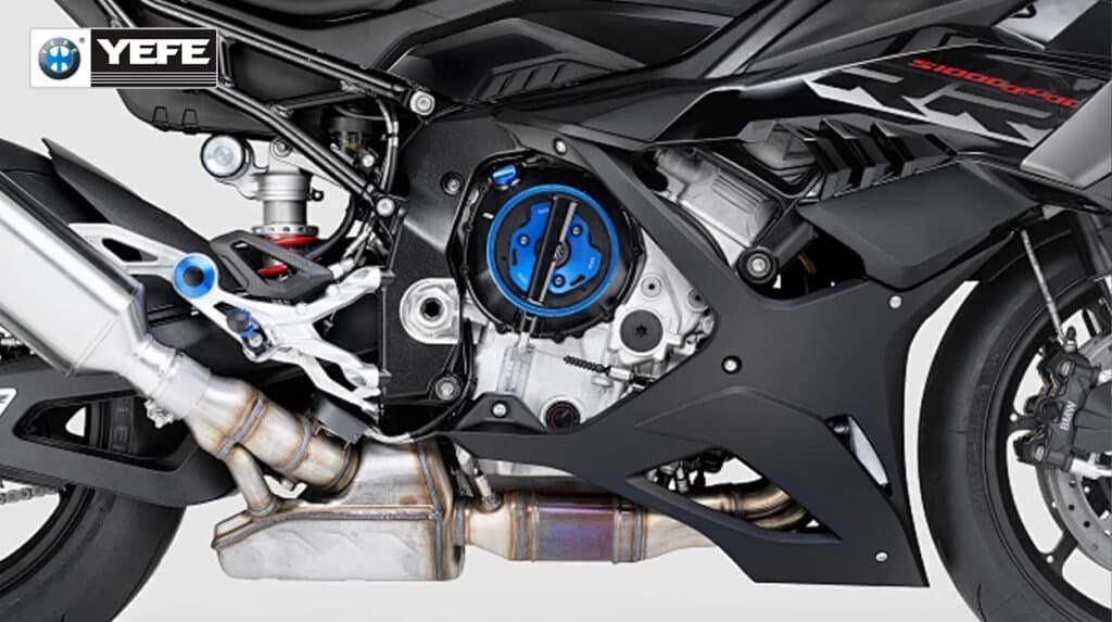 Close-up of BMW S1000RR motorcycle engine highlighting the blue wet clutch assembly, showing why JASO MA2 motorcycle oil from YEFE provides higher friction stability for high-performance bikes compared to MA or MB standards.