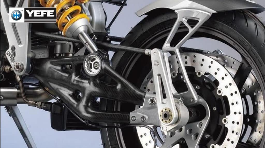 YEFE motorcycle rear wheel showing chain drive, suspension and transmission components requiring specialized motorcycle oil with JASO MA2 standards for wet clutch compatibility, demonstrating why automotive engine oil cannot protect motorcycle engines with shared lubrication systems for engine, gearbox, and clutch components