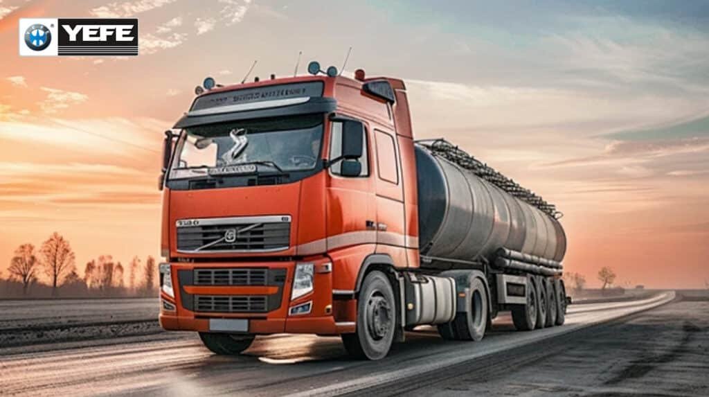 Red Volvo tanker truck hauling oil on rural road at sunset, representing commercial vehicles with hydraulic systems that demand proper viscosity and additives to avoid pump damage, foaming, corrosion, and efficiency loss from wrong hydraulic oil.