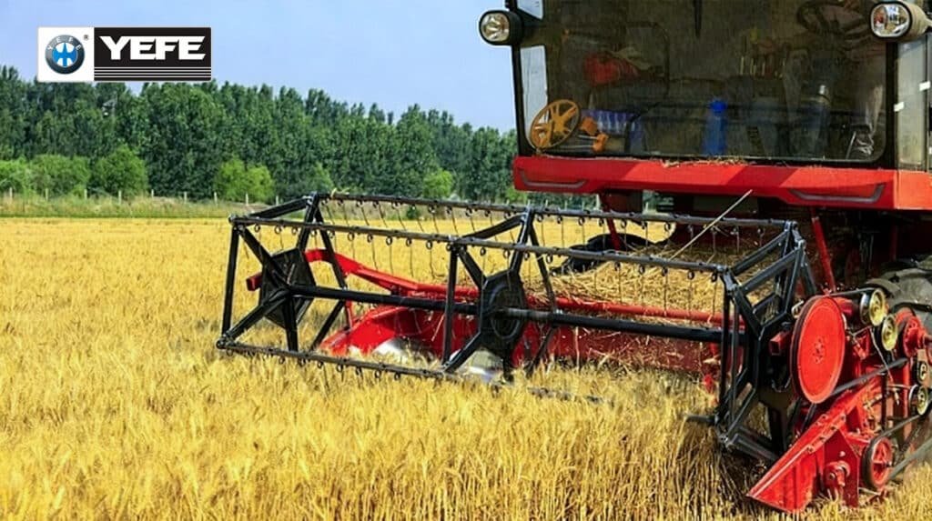 Agricultural tractor with red tillage implement working in the field, powered by YEFE hydraulic oil that protects multi-function farm equipment systems in seasonal agricultural conditions