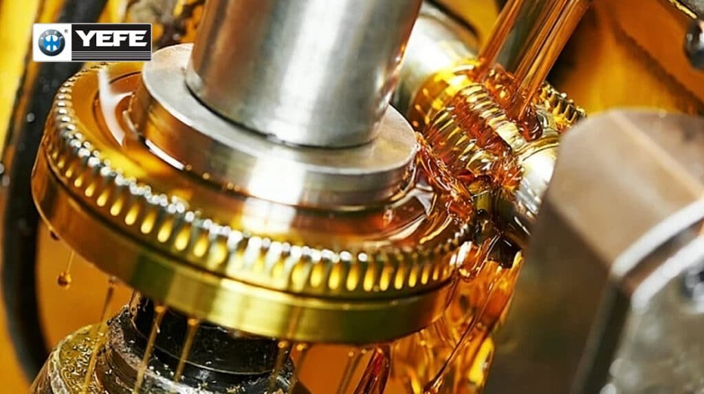 Close-up of golden transmission fluid coating metallic gears and bearings inside an automatic or DCT gearbox, demonstrating critical lubrication, heat dissipation and friction control — essential for preventing wear in high-torque applications where OEM-specified ATF, CVT or DCT oil is required.