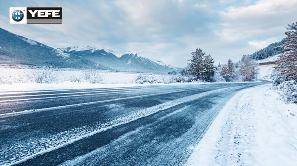 YEFE transmission oil for cold climates showing snowy winter road and mountain conditions, demonstrating the need for specialized transmission fluid with excellent low-temperature flow properties, cold start protection, and rapid circulation in sub-zero temperatures to prevent sluggish shifting, reduce wear during cold starts, and maintain reliable transmission performance in harsh winter driving conditions