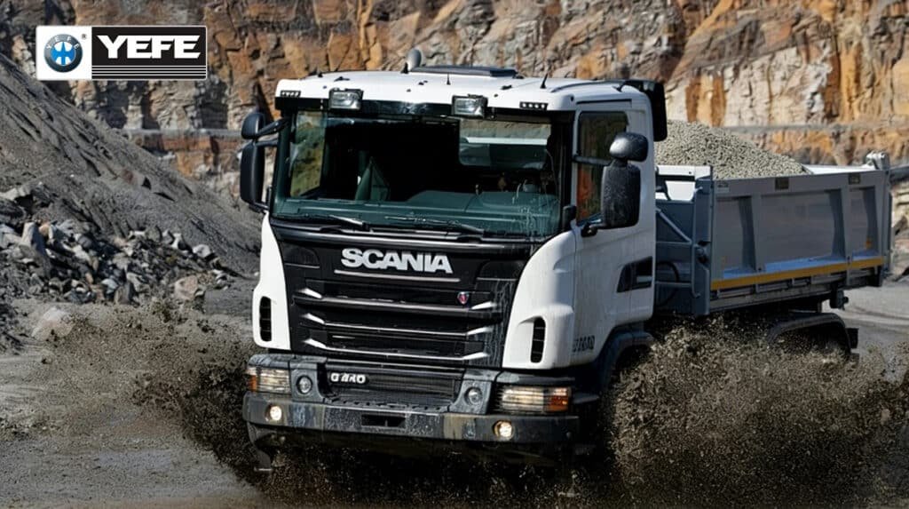 YEFE transmission oil for construction and agricultural machinery showing Scania dump truck operating in harsh mining and construction conditions with heavy loads, dust, and mud, demonstrating the need for specialized heavy-duty transmission fluid with shear stability, thermal protection, anti-wear additives, and contamination resistance to protect powershift and manual transmissions in demanding off-road construction equipment and agricultural machinery