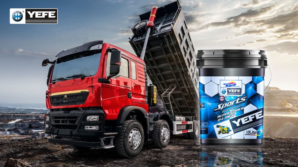 Red heavy-duty dump truck actively unloading material in a rugged, dusty mining or construction environment, alongside a 18-liter pail of YEFE Sports full synthetic diesel engine oil (CF-4 20W-50), visually demonstrating how advanced lubrication with double oil film protection combats abrasive contamination and thermal stress to maintain engine integrity and performance in severe-duty, high-load off-road applications.
