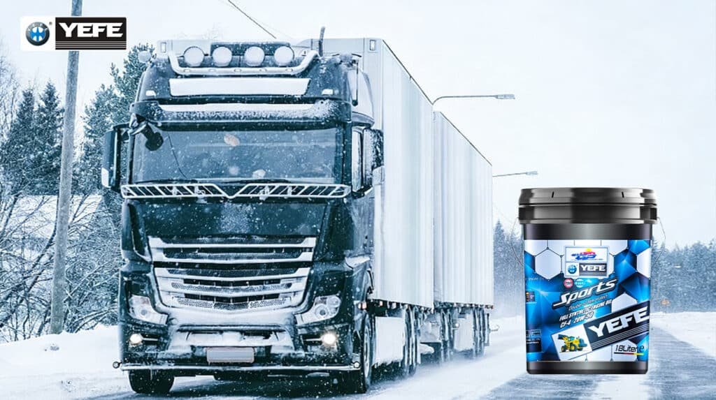 A black heavy-duty long-haul semi-truck driving on a snow-covered highway in a winter environment, with a 18-liter pail of YEFE Sports full synthetic diesel engine oil (CF-4 20W-50) displayed in the foreground; the scene illustrates the product’s double oil film protection technology engineered to maintain viscosity stability, resist thermal breakdown, and provide superior wear protection under sustained high-heat and continuous load conditions typical of long-haul transportation, even in extreme cold climates.
