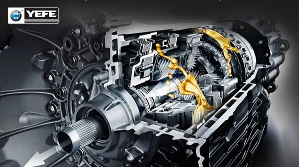 Cutaway view of an automatic transmission gearbox showing yellow automatic transmission fluid (ATF) flowing over clutches and gears, demonstrating how YEFE transmission oil provides lubrication, cooling, and hydraulic control in automatic gearboxes.