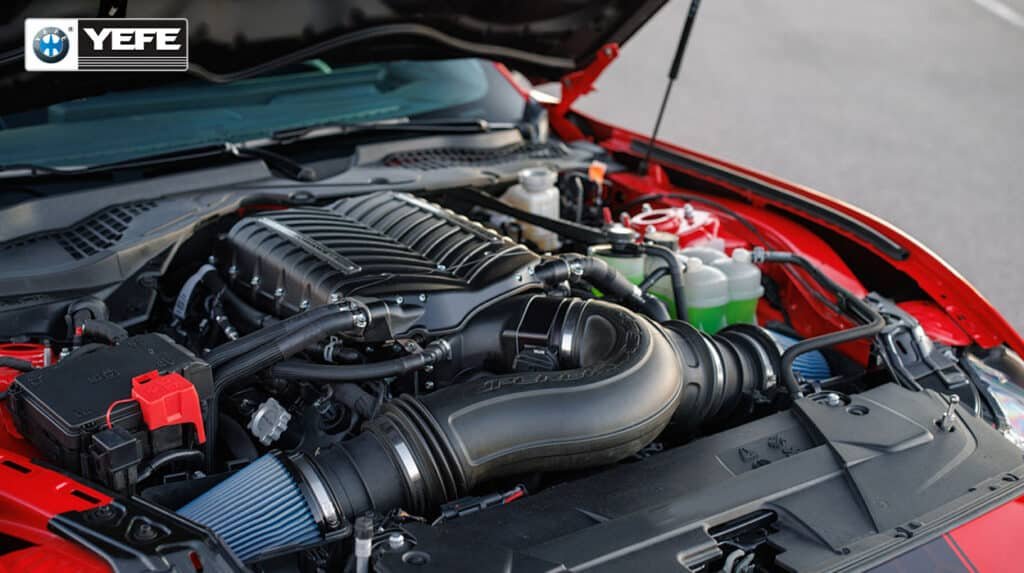 A detailed view of a high-performance V8 engine with a prominent air intake system, highlighting the complex and powerful machinery that requires precise lubrication. This image supports the article "Can Mixing Different Engine Oils Damage Your Engine?" by visually representing the type of advanced engine where oil compatibility is paramount. Using incompatible oils can disrupt the delicate balance of additives and viscosity, leading to reduced protection, increased wear on critical components like camshafts and bearings, and potential long-term damage, especially under high-stress conditions.