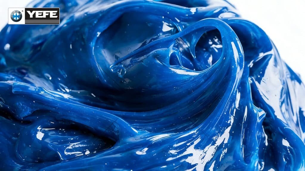Macro texture shot of YEFE premium blue polyurea lithium complex grease, available in full packaging lineup: 400g grease gun cartridges, 1kg–18kg plastic pails, 50/180kg metal drums and 1000L IBC bulk totes, flexible OEM private label printing for every container size, matching automotive workshop, industrial plant and heavy fleet consumption demands